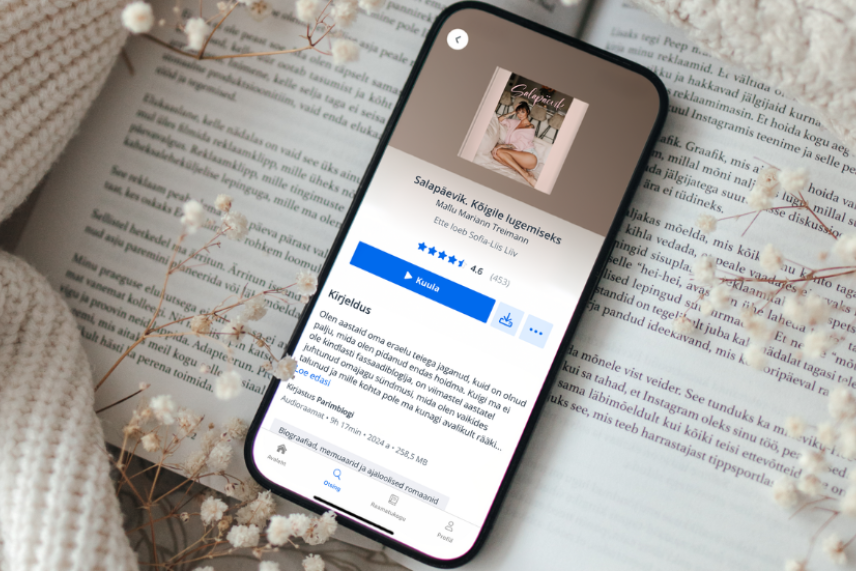 telefon laual, elisa raamatu äpp avatud